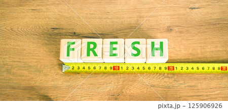 Fresh symbol. Concept word Fresh on beautiful wooden blocks. Beautiful wooden table wooden background. Beautiful yellow ruler. Business lifestyle fresh concept. Copy space. Fresh symbol. Concept word Fresh on beautiful wooden blocks. Beautiful wooden table wooden background. Beautiful yellow ruler. Business lifestyle fresh concept. Copy space. 125906926