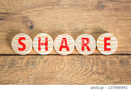Share symbol. Concept word Share on beautiful wooden circles. Beautiful wooden table wooden background. Business lifestyle share concept. Copy space. 125906942