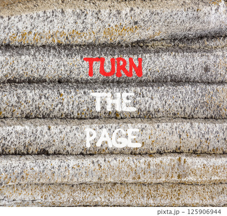 Turn the page symbol. Concept words Turn the page on beautiful grey stone wall. Beautiful grey mountain stone wall background. Business motivational lifestyle turn the page concept. Copy space. Turn the page symbol. Concept words Turn the page on beautiful grey stone wall. Beautiful grey mountain stone wall background. Business motivational lifestyle turn the page concept. Copy space. 125906944