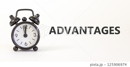 Advantages symbol. Concept word Advantages on beautiful white paper. Beautiful white paper background. Black alarm clock. Business advantages concept. Copy space. Advantages symbol. Concept word Advantages on beautiful white paper. Beautiful white paper background. Black alarm clock. Business advantages concept. Copy space. 125906974