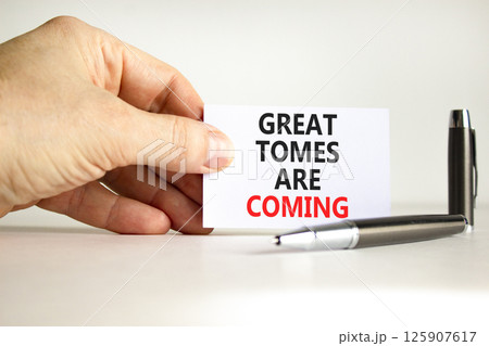 Great times are coming symbol. Concept words Great times are coming on beautiful white paper. Beautiful white background. Businessman hand. Business great times are coming concept. Copy space. Great times are coming symbol. Concept words Great times are coming on beautiful white paper. Beautiful white background. Businessman hand. Business great times are coming concept. Copy space. 125907617
