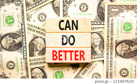 Can do better symbol. Concept words Can do better on beautiful wooden blocks. Dollar bills. Beautiful background from dollar bills. Business and can do better concept. Copy space. 125907620
