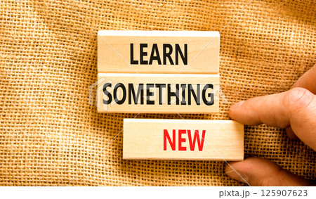 Learn something new symbol. Concept words Learn something new on beautiful block. Businessman's hand. Beautiful canvas background Business motivational lifestyle learn something new concept Copy space 125907623