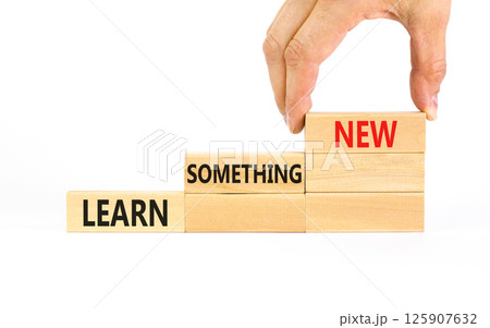 Learn something new symbol. Concept words Learn something new on beautiful block. Businessman's hand. Beautiful white background Business motivational lifestyle learn something new concept Copy space 125907632