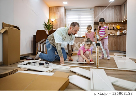 Working together to build a new playroom in the cozy home Working together to build a new playroom in the cozy home 125908158