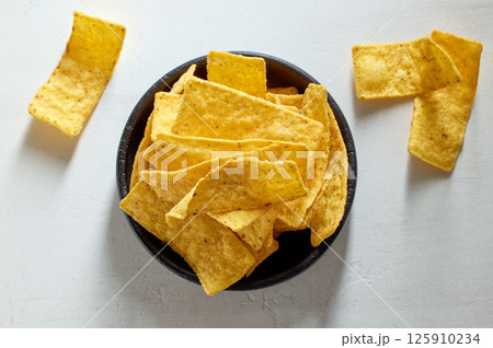 bowl of tortilla strip nachos chips 125910234