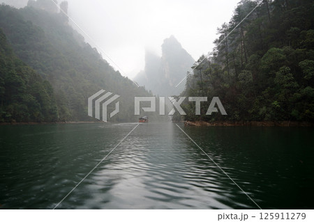 Misty Baofeng Lake with Calm Water and Rock Cliffs in Zhangjiajie, China 125911279