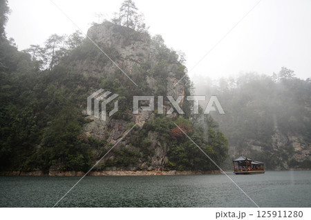 Misty Baofeng Lake with Calm Water and Rock Cliffs in Zhangjiajie, China 125911280