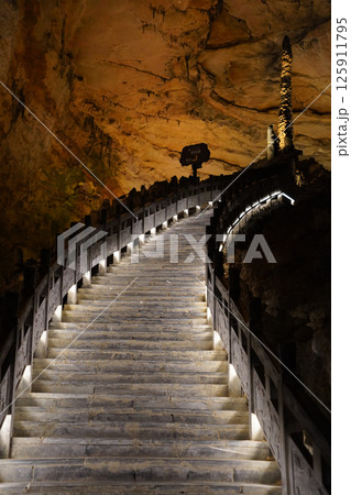 Illuminated Staircase Leading into the Mystical Huanglong Cave, Zhangjiajie, China Illuminated Staircase Leading into the Mystical Huanglong Cave, Zhangjiajie, China 125911795