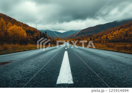 Serene Road Scene with Clean White Arrow Lines 125914894