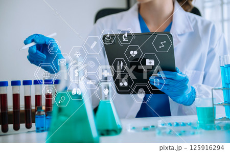 Dctor work on digital tablet healthcare doctor technology tablet using computer in laboratory study with VR icon Dctor work on digital tablet healthcare doctor technology tablet using computer in laboratory study with VR icon 125916294