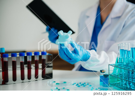 Coronavirus COVID-19 medical test vaccine research and development concept.in a chemistry lab. Coronavirus COVID-19 medical test vaccine research and development concept.in a chemistry lab. 125916295