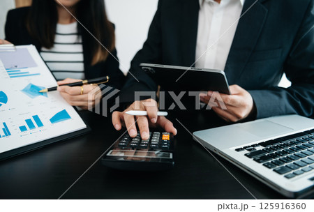 Business team meeting present.professional investor working with Finance managers task. with digital tablet,smartphone and laptop at office 125916360