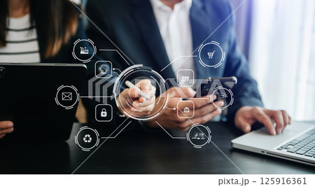 Business team present professional investor working new start up project. Digital tablet laptop computer Finance managers meeting with digital marketing media in virtual icon Business team present professional investor working new start up project. Digital tablet laptop computer Finance managers meeting with digital marketing media in virtual icon 125916361