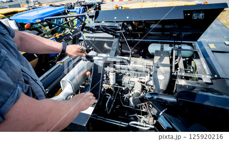 Modern new agricultural tractor engine. Machinery and equipment Modern new agricultural tractor engine. Machinery and equipment 125920216