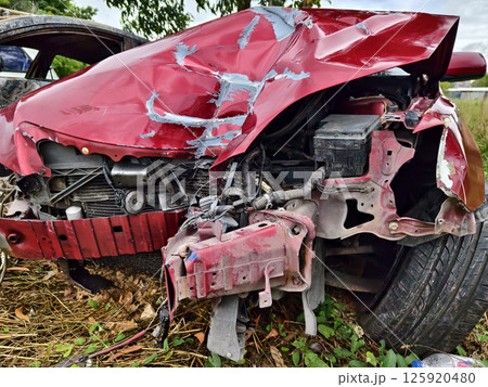 Abandoned cars after accidents in a dense overgrown setting 125920480