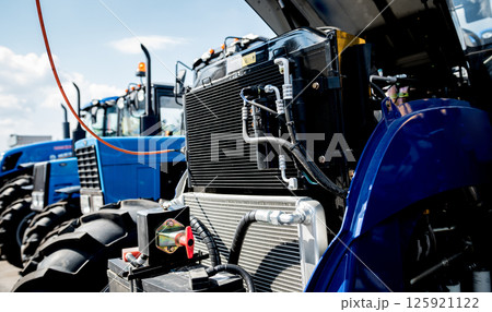 Modern new agricultural tractor engine. Machinery and equipment Modern new agricultural tractor engine. Machinery and equipment 125921122