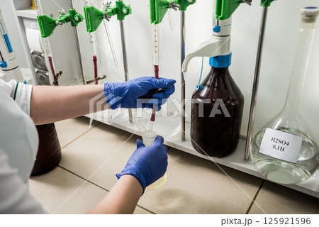 Natural oil quality control. In the industrial laboratory. Natural oil quality control. In the industrial laboratory. 125921596