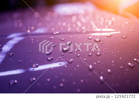 Water drops on violet background. Car details 125921772