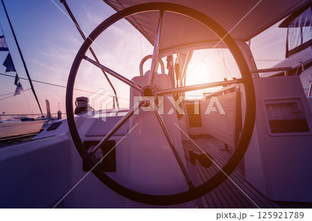 A modern speed boat yacht steering wheels. 125921789