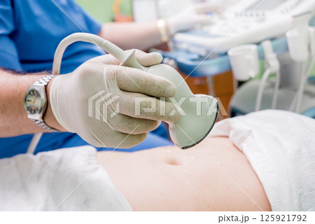 Ultrasound scanner in the hands of a doctor. Diagnostics. Ultrasound scanner in the hands of a doctor. Diagnostics. 125921792