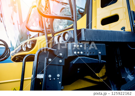 Modern agricultural machinery and equipment. Yellow agricultural harvester. 125922162