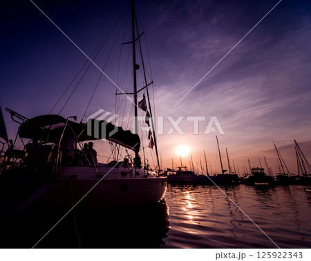 Beautiful view of marina and harbor with yachts and motorboats.  125922343