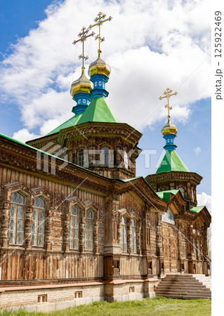 Wooden facade of Holy Trinity Cathedral in Karakol city, Kyrgyzstan Wooden facade of Holy Trinity Cathedral in Karakol city, Kyrgyzstan 125922469