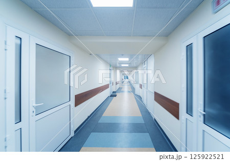Empty long corridor in the modern clinic. 125922521