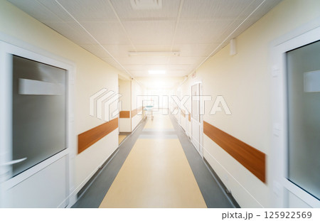 Empty long corridor in the modern clinic. Empty long corridor in the modern clinic. 125922569