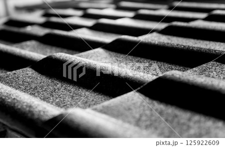 Gray metallic roof tiles background with light pattern. 125922609