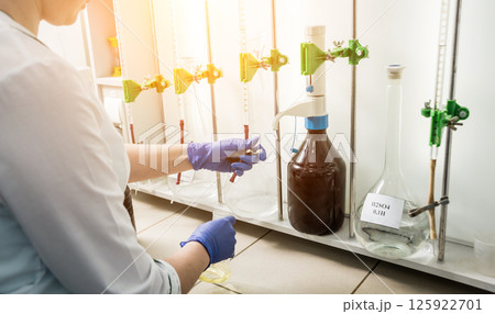 Natural oil quality control. In the industrial laboratory. 125922701