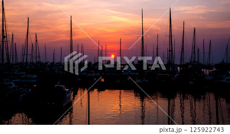 Beautiful view of marina and harbor with yachts and motorboats. Beautiful view of marina and harbor with yachts and motorboats. 125922743