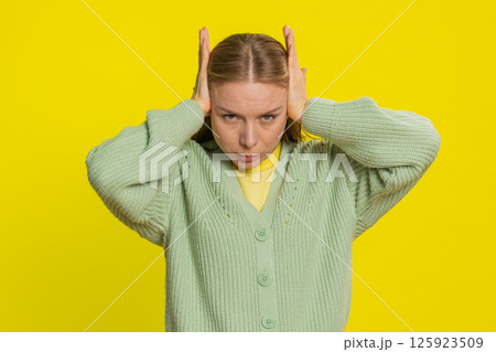 Annoyed irritated woman covering ears gesturing no avoiding advice ignoring noise loud voices Annoyed irritated woman covering ears gesturing no avoiding advice ignoring noise loud voices 125923509