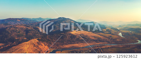 Top view of colorful mountain slopes and river Stryi on a sunny autumn day. Beautiful landscape. Carpathians, Carpathian Ruthenia, Ukraine. Horizontal banner 125923612
