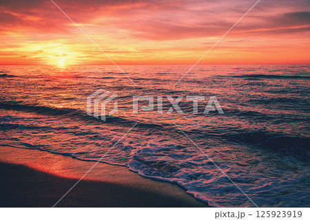 Seascape in the evening. Sunset over the sea. Dramatic sky. Natural landscape Seascape in the evening. Sunset over the sea. Dramatic sky. Natural landscape 125923919