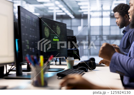 Developer receiving access granted notification while reconfiguring server farm, optimizing it. Worker ensures data center operates efficiently, happy after successfully eliminating all errors Developer receiving access granted notification while reconfiguring server farm, optimizing it. Worker ensures data center operates efficiently, happy after successfully eliminating all errors 125924130