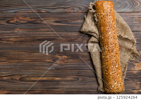 fresh crunchy french baguette on colored table. Top view Bakery products fresh crunchy french baguette on colored table. Top view Bakery products 125924264