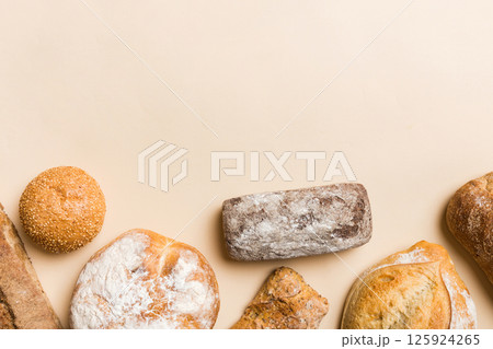 Homemade natural breads. Different kinds of fresh bread as background, top view with copy space 125924265