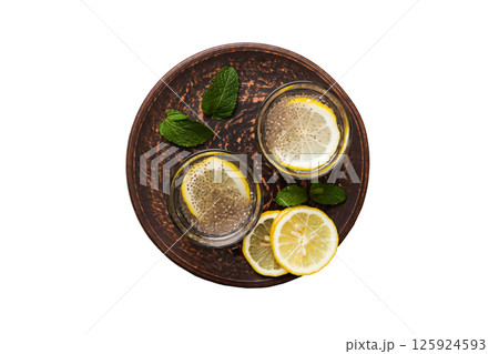 Healthy breakfast or morning with chia seeds lemon and mint on table background, vegetarian food, diet and health concept. Chia pudding with lemon and mint 125924593