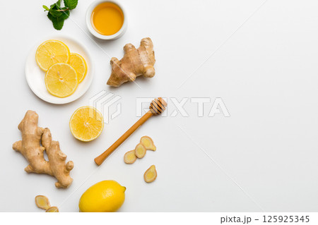 Natural cold and flu home remedies. Natural ingredients for immunity stimulation and viruses protection. top view flat lay Natural cold and flu home remedies. Natural ingredients for immunity stimulation and viruses protection. top view flat lay 125925345