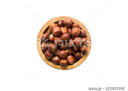 Roasted hazelnut in bowl isolated on white background. hazelnut is snack or raw of cook. Healthy food concept Roasted hazelnut in bowl isolated on white background. hazelnut is snack or raw of cook. Healthy food concept 125925395