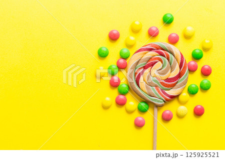 Tasty appetizing Party Accessories Happy Birthday Sweet. Different types of candies on colored background, copy space. Colorful birthday party background Tasty appetizing Party Accessories Happy Birthday Sweet. Different types of candies on colored background, copy space. Colorful birthday party background 125925521