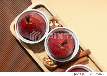 Tasty and delicious food concept - pear in wine Tasty and delicious food concept - pear in wine 125925877