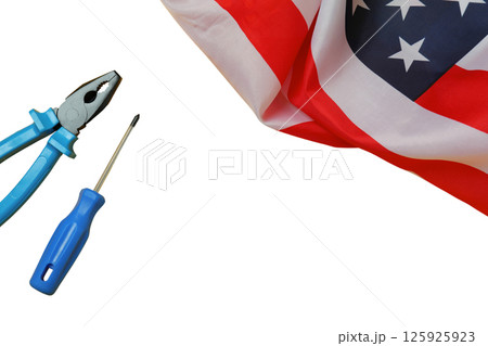 Labor Day features tools symbolizing work alongside the American flag, isolated on white Labor Day features tools symbolizing work alongside the American flag, isolated on white 125925923