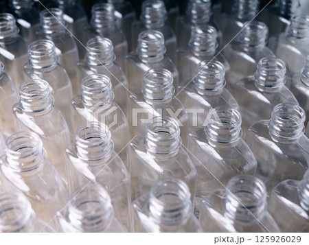 Close up Row of plastic drink water bottles for filling process. 125926029