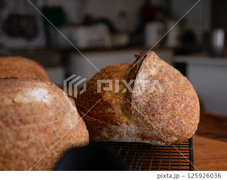 Freshly Baked Sourdough Loaf on Cafe table. Freshly Baked Sourdough Loaf on Cafe table. 125926036