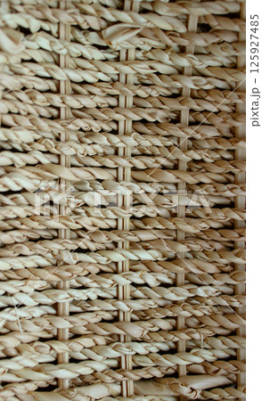 Vertical photography for backgrounds of wicker twigs in shape of spikelets  125927485