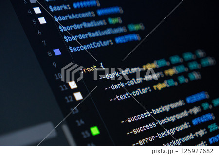 close-up of computer screen with colorful css code, focus on root selector, web development, frontend design and programming 125927682