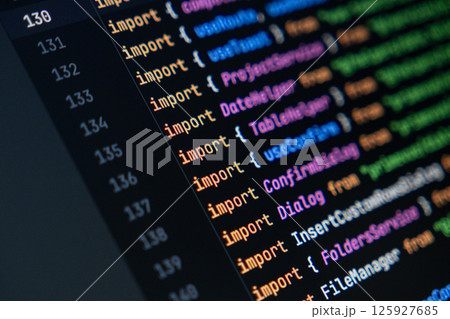 close-up of computer screen with colorful javascript code, focus on import statement, software development and programming 125927685